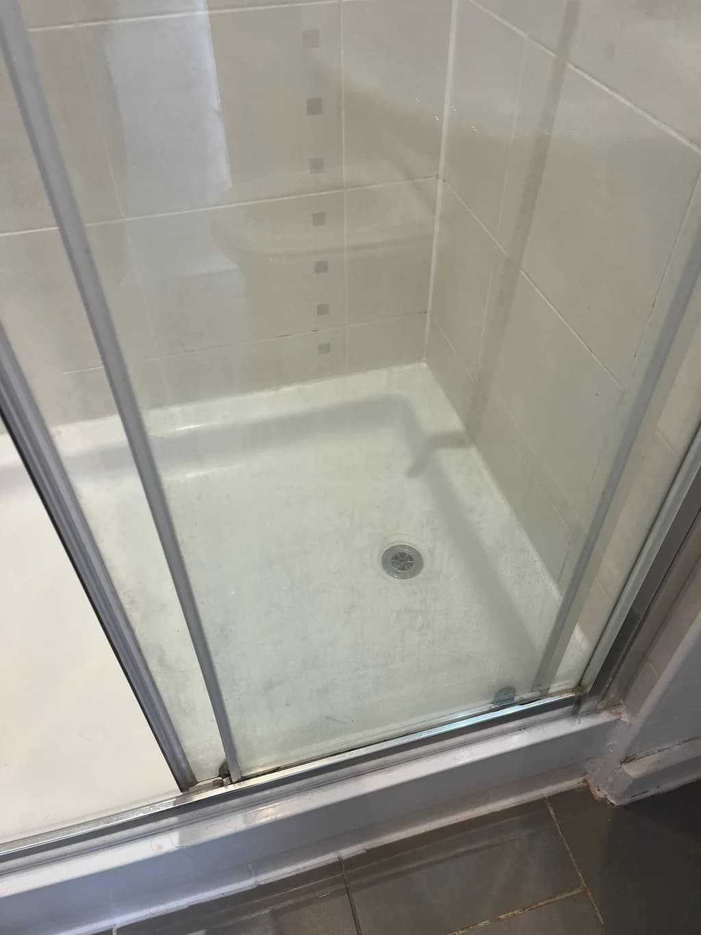 Sliding shower door clouded before regular domestic clean