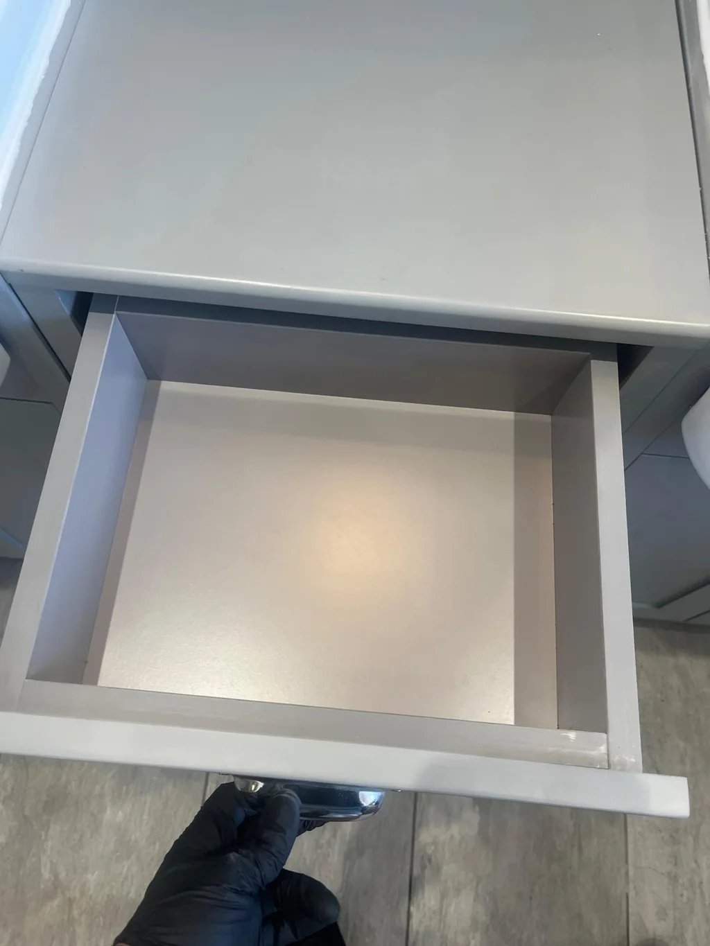 Empty vanity drawer wiped clean for the new occupants